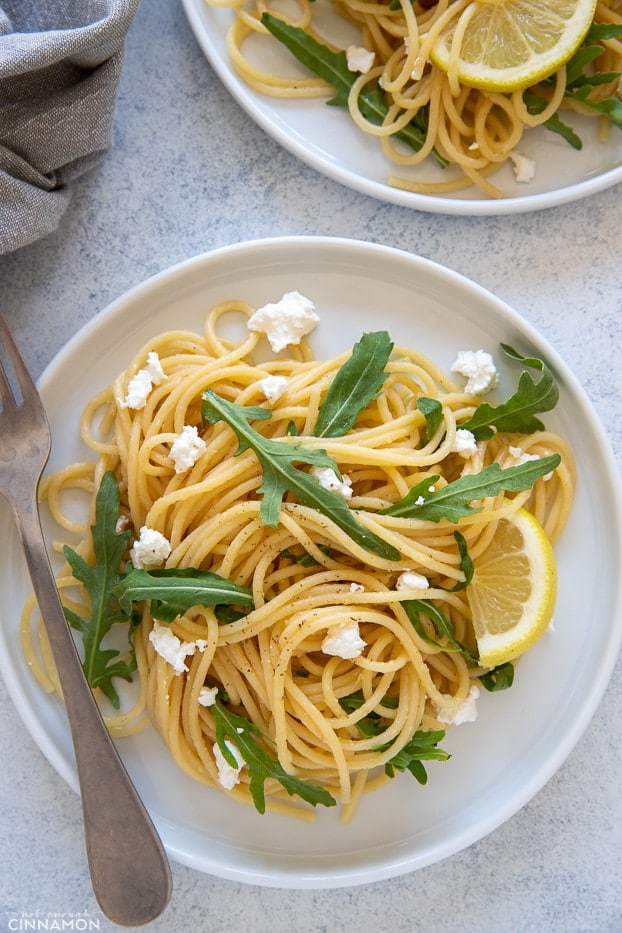 easy healthy lemon pasta served with crumbled feta and arugula 