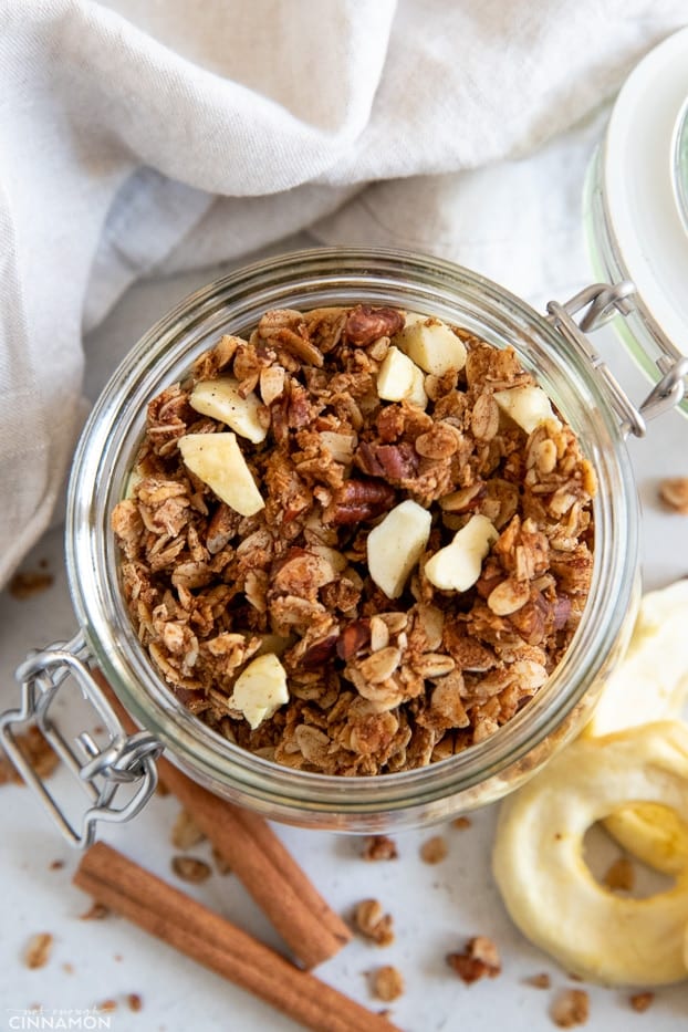 overhead shot of a mason jar with healthy apple pie granola