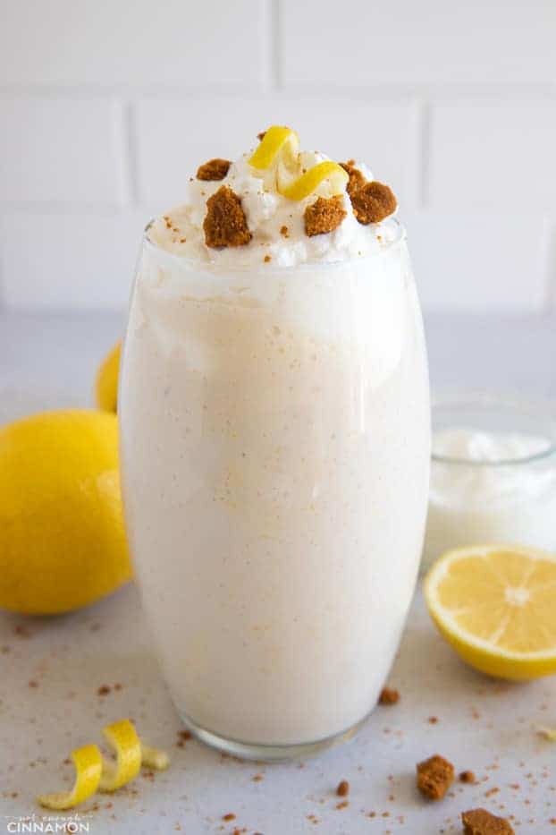 side view of lemon cream pie protein shake topped with coconut whipped cream 