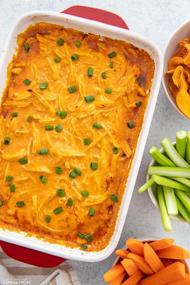 overhead shot of paleo buffalo chicken dip in a white casserole dish 