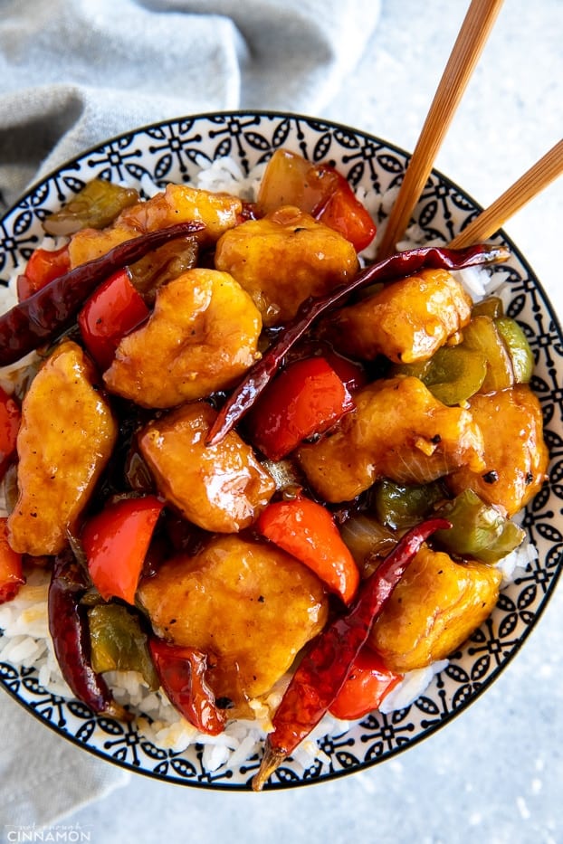 overhead shot of a bowl of healthy Chinese Szechuan chicken stir fry served with rice 