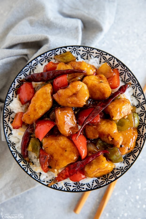 overhead shot of a bowl with rice topped with Chinese 5 Spice Chicken 