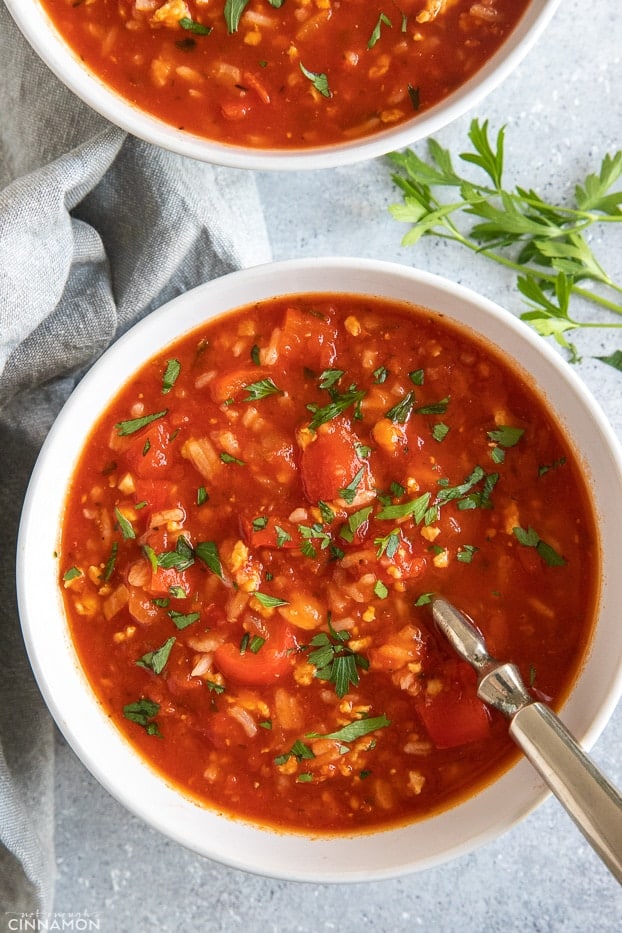 overhead shot of a bowl of stuffed bell pepper soup with a spoon 