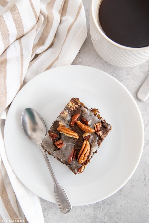 overhead shot of a square of gingerbread baked oatmeal with a spoon on the side