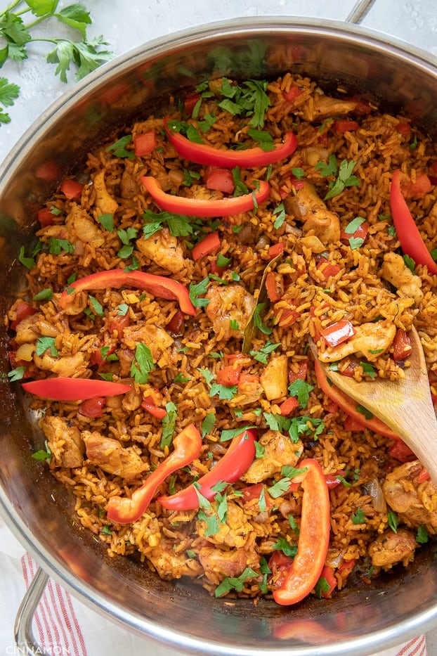 overhead shot of a pot with Jollof chicken and rice 