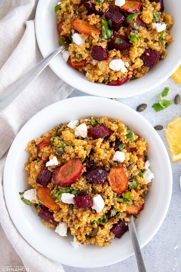 overhead shot of two bowls with quinoa beet salad with goat cheese