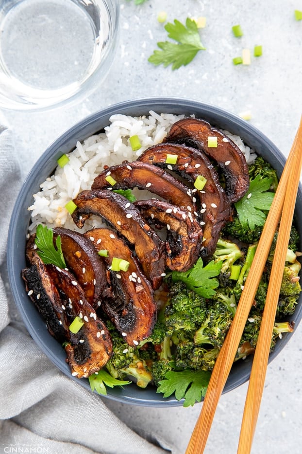 overhead shot of a teriyaki rice bowl topped with roasted teriyaki glazed portobello mushrooms 