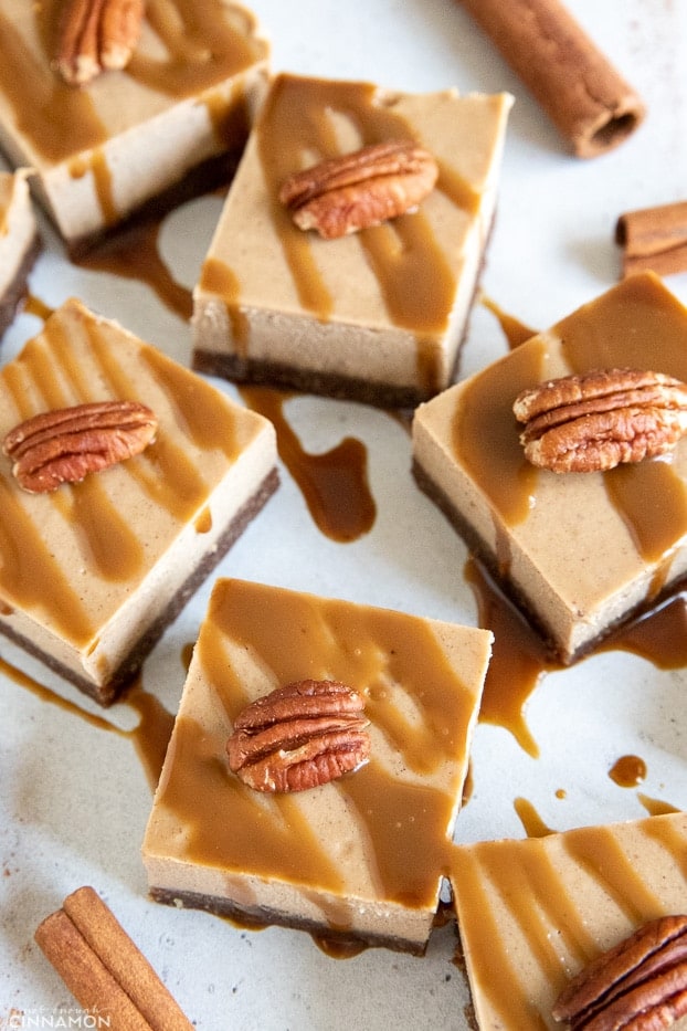 overhead shot of vegan no bake chai latte cheesecake bars drizzled with coconut caramel 