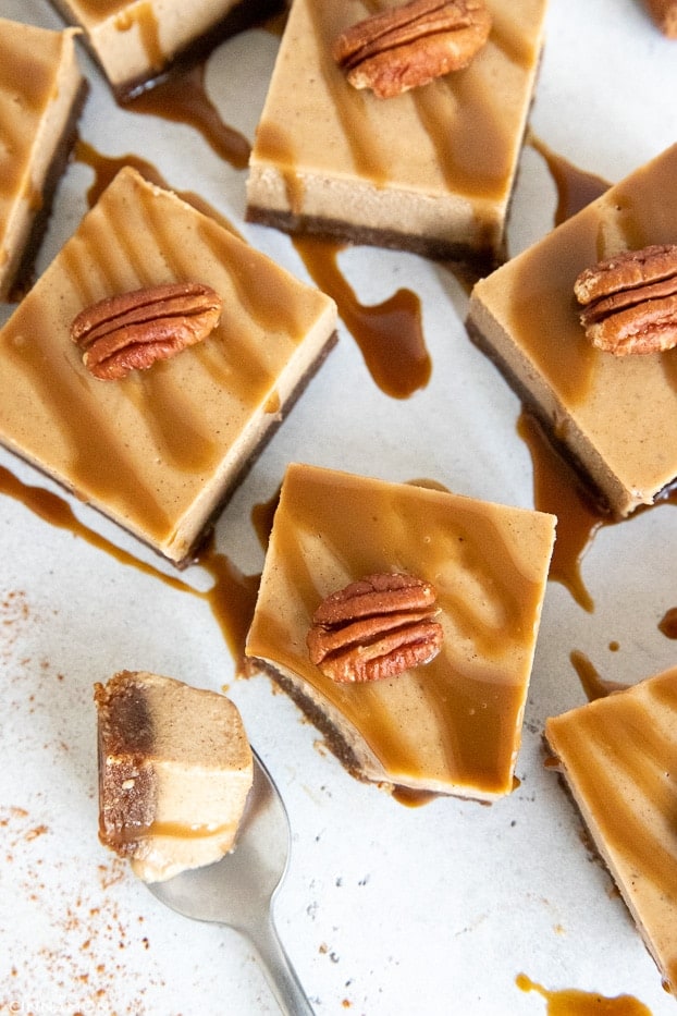 vegan chai latte cheesecake bars served with caramel drizzle and pecans