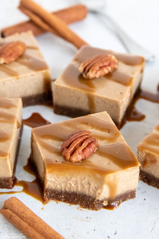 close up of a square of vegan chai latte cheesecake with one bite missing 