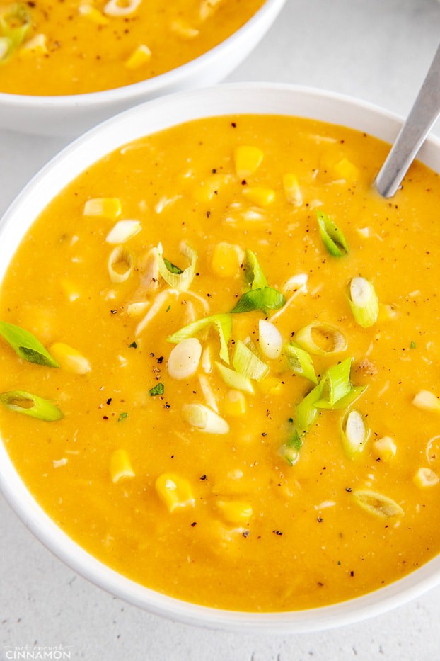 a bowl of healthy dairy-free slow cooker chicken corn chowder with a spoon 