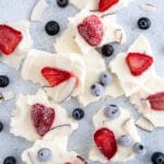 healthy frozen yogurt bark with strawberries and blueberries