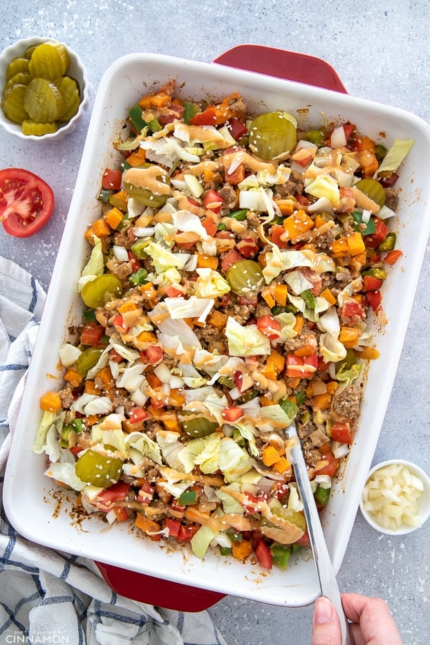 overhead shot of a big mac burger casserole with a spoon 