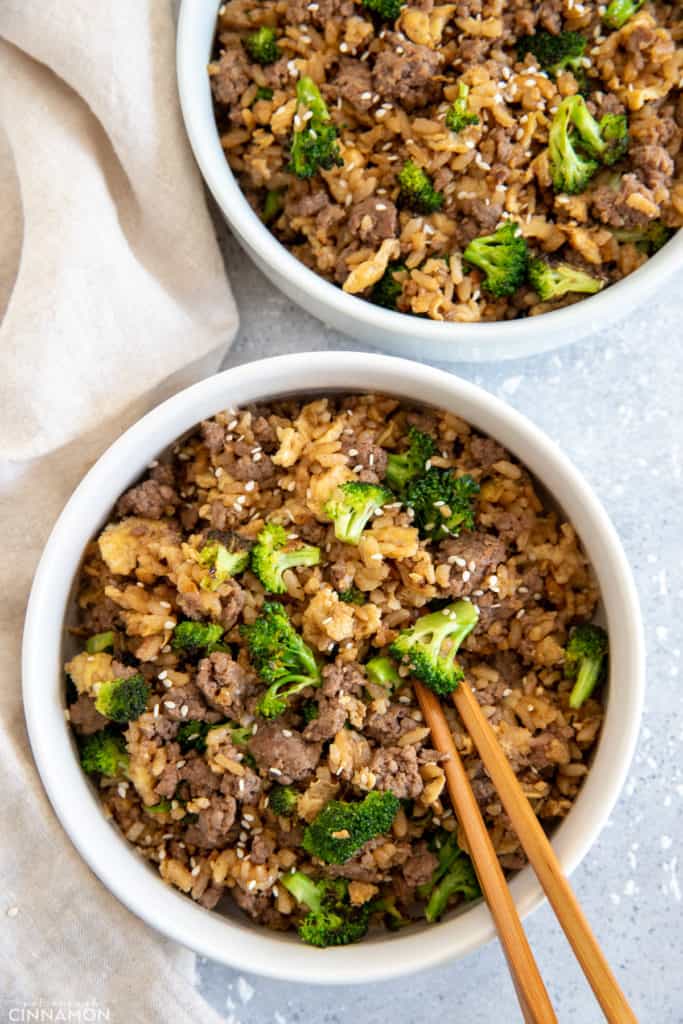 overhead shot of two bowls of beef and broccoli fried rice