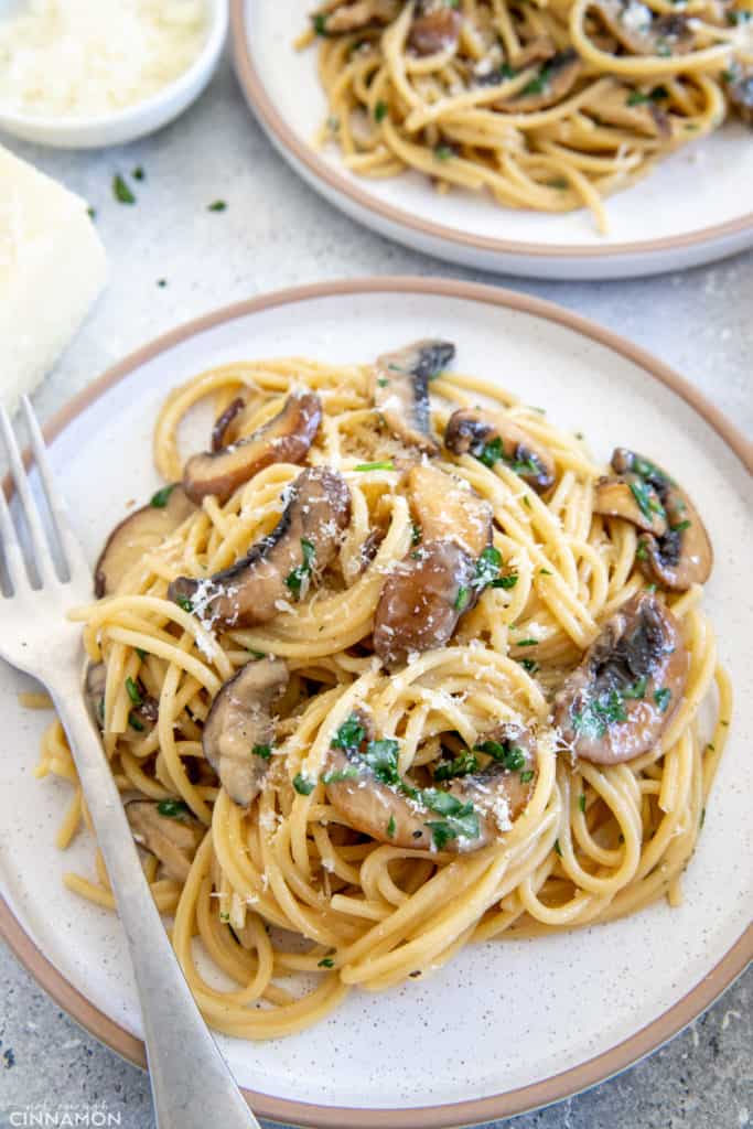 mushroom carbonara served on a white plate