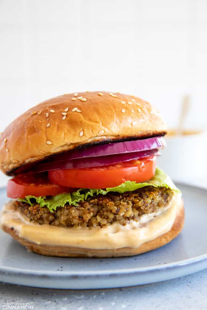 Shiitake Quinoa Mushroom Burger with Miso Aioli on a small plate 